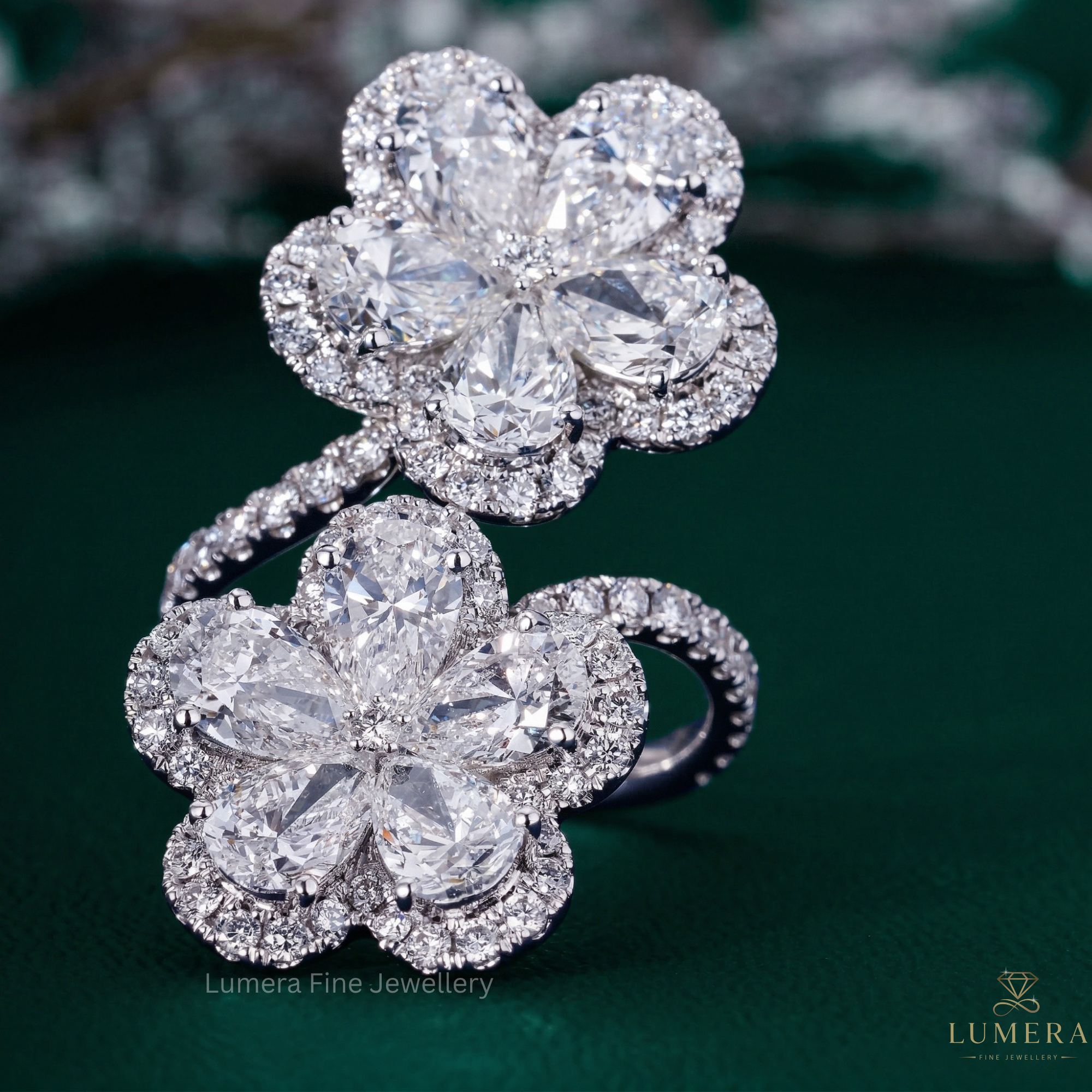 pear shaped diamond engagement ring with bypass engagement ring.