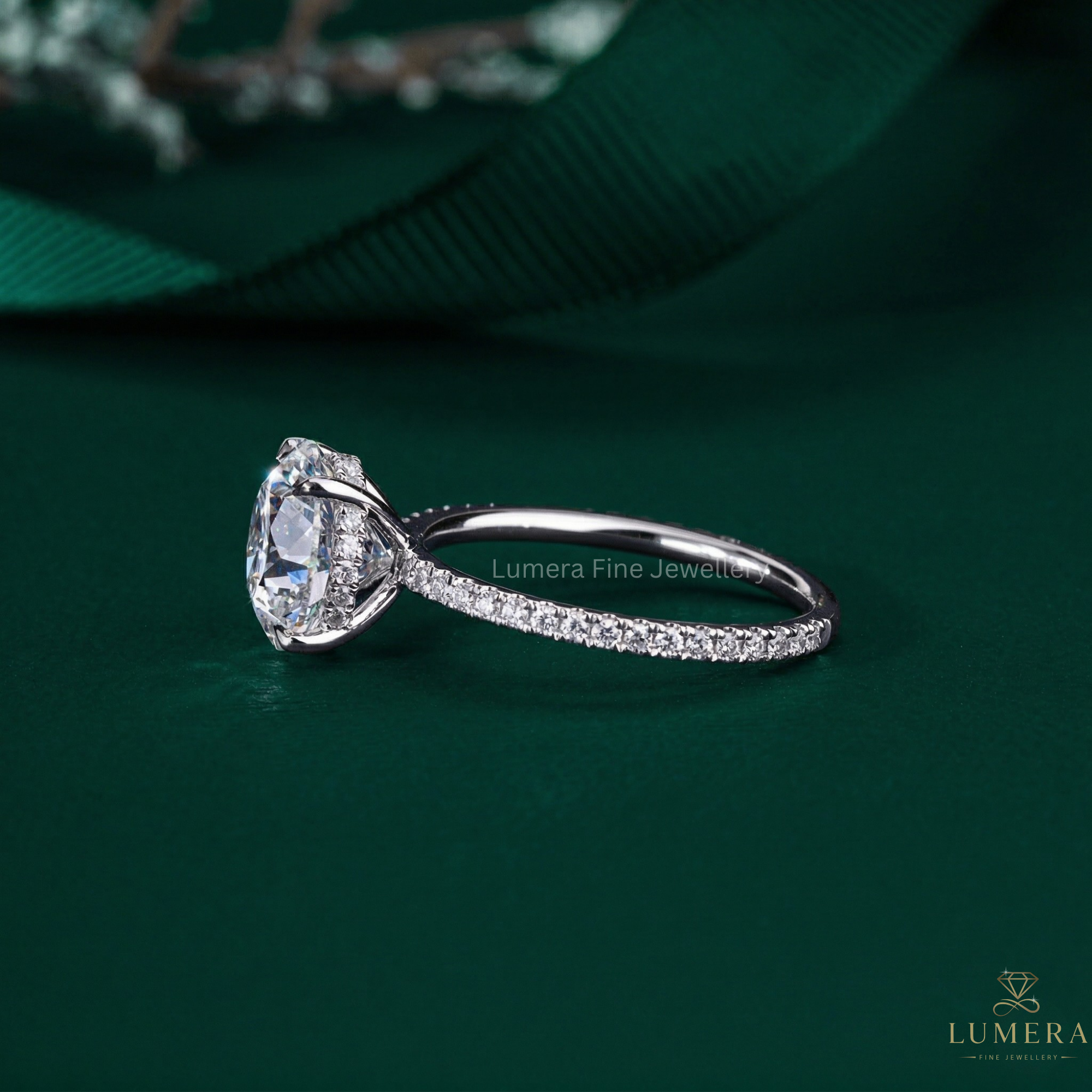 round brillient cut ring in hidden halo setting ring style.
