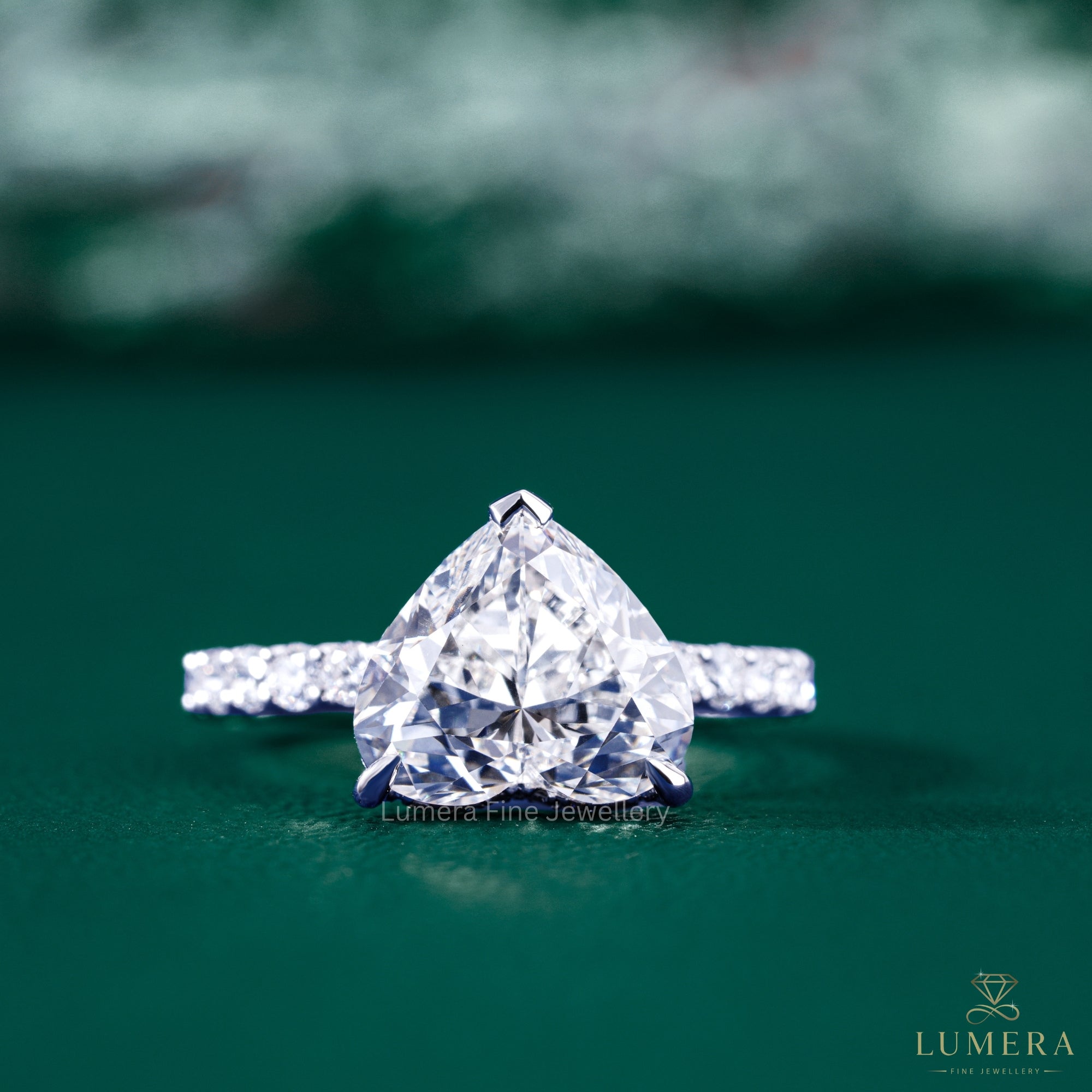 Heart cut engagement ring with hidden halo.
