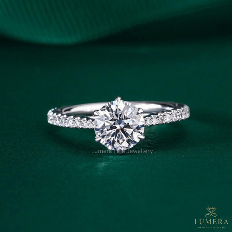 round cut engagement ring with tapered shank engagement ring.

