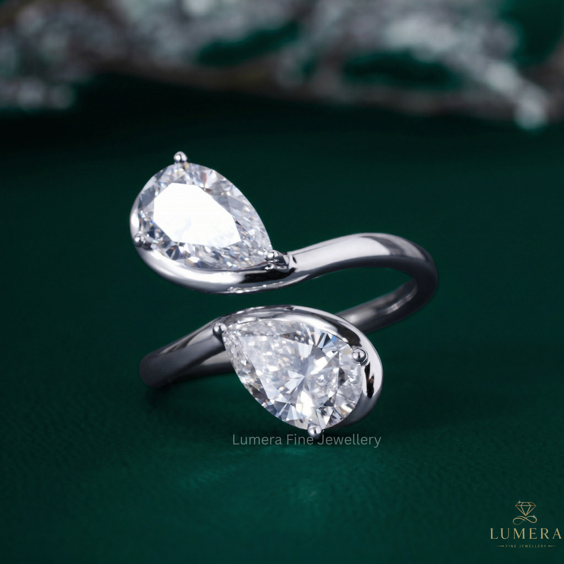 Almond shape engagement ring with Bypass pear diamond ring.