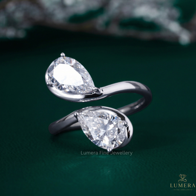 Almond shape engagement ring with Bypass pear diamond ring.