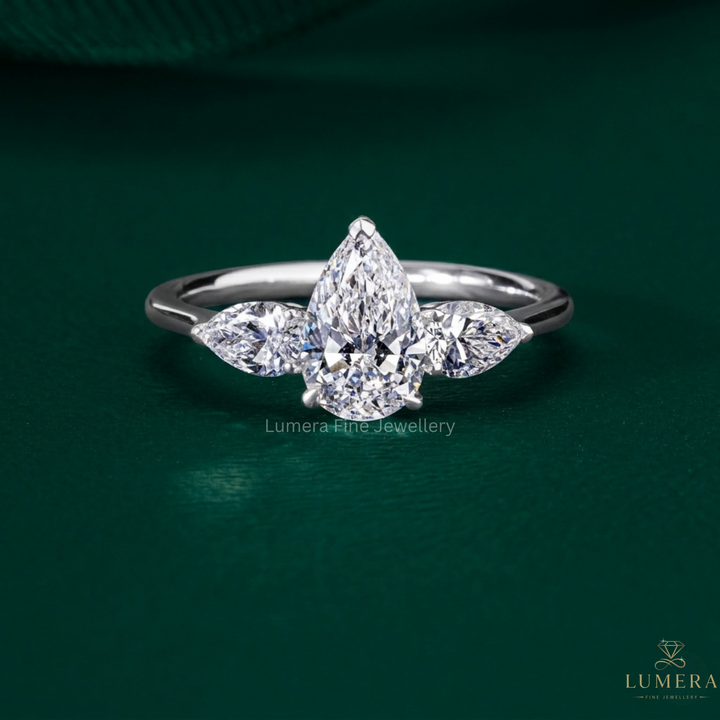 three stone diamond ring with pear three stone engagement ring.
