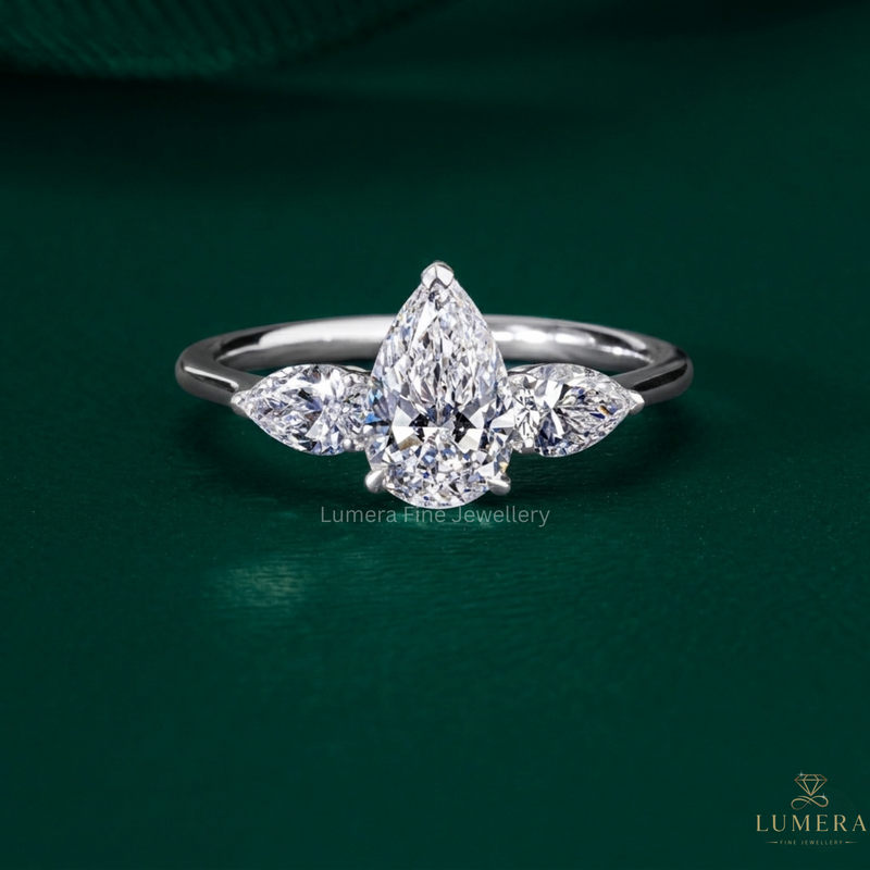 three stone diamond ring with pear three stone engagement ring.
