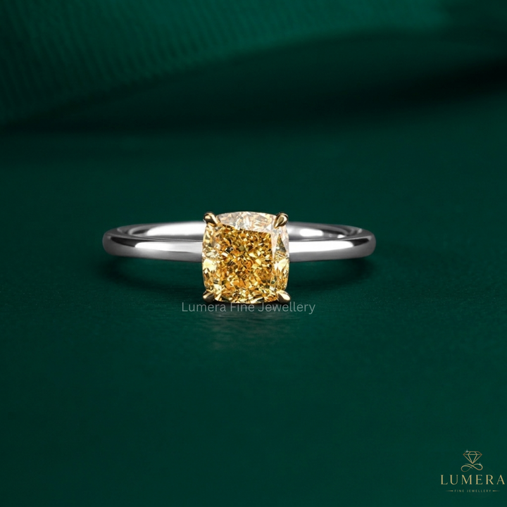cushion cut engagement ring with yellow diamond ring.
