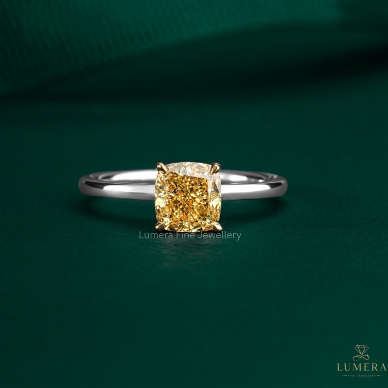 cushion cut engagement ring with yellow diamond ring.
