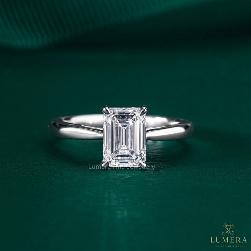 emerald cut engagement ring with solitaire setting ring.
