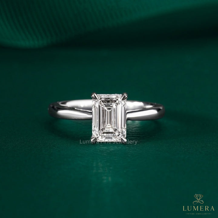 emerald solitaire engagement ring in solid gold.
