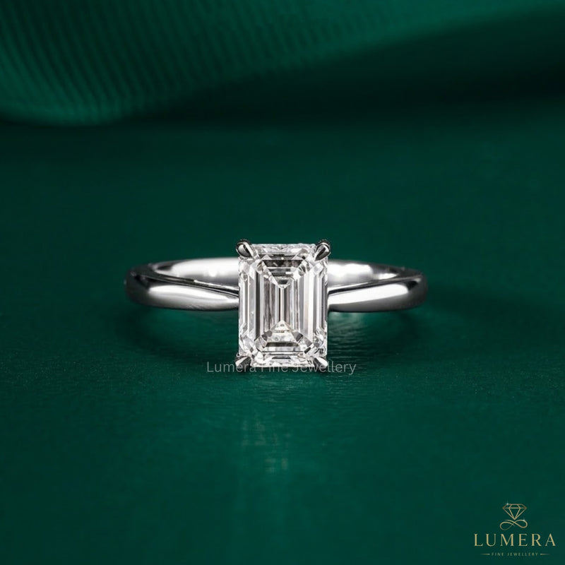 emerald solitaire engagement ring in solid gold.
