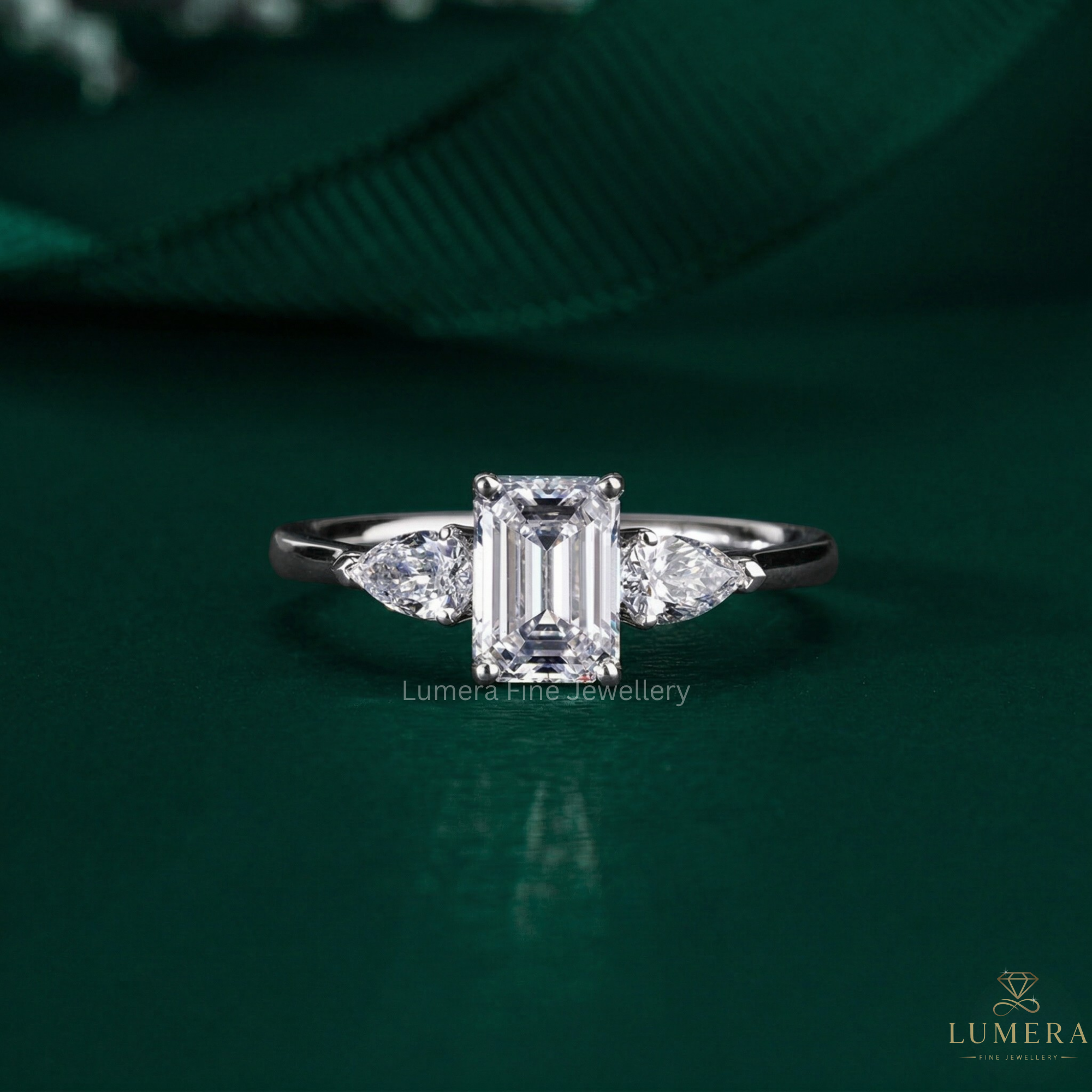 emerald cut ring with three stone ring.
