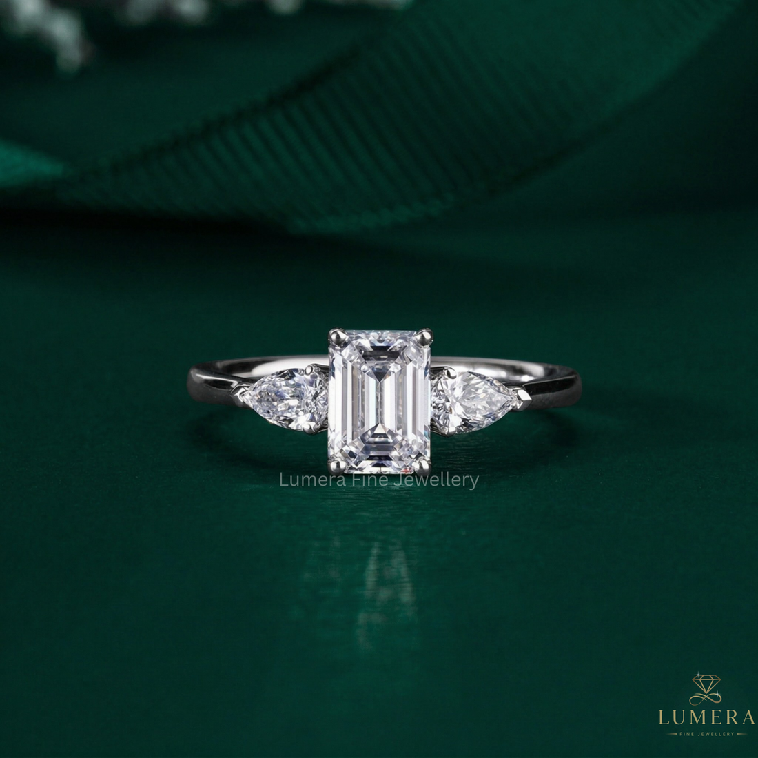 emerald cut ring with three stone ring.
