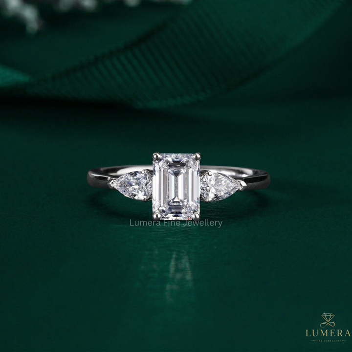 emerald cut ring with three stone ring.

