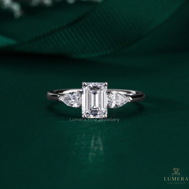 emerald cut ring with three stone ring.

