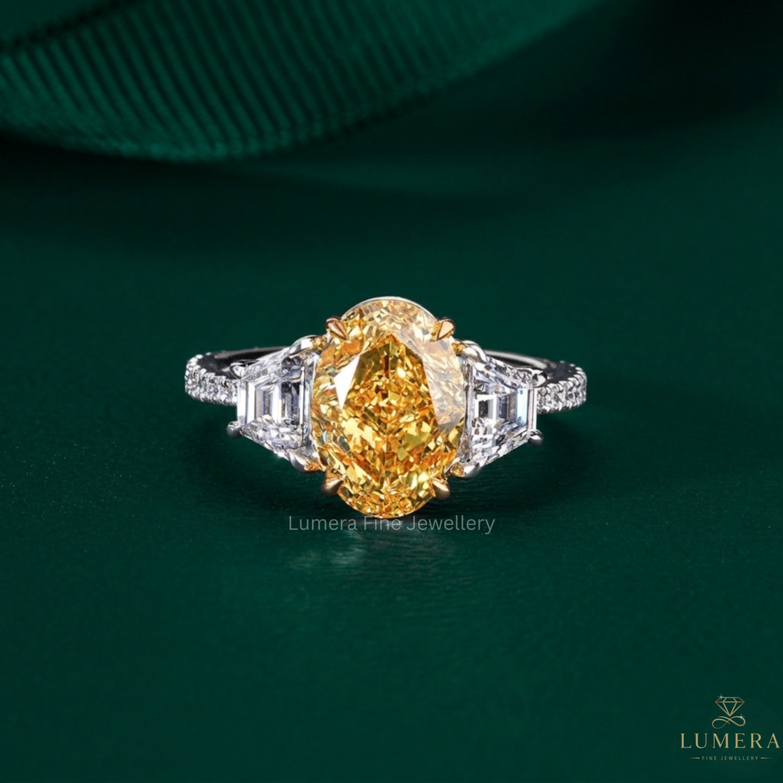 oval shaped diamond ring with yellow engagement ring.
