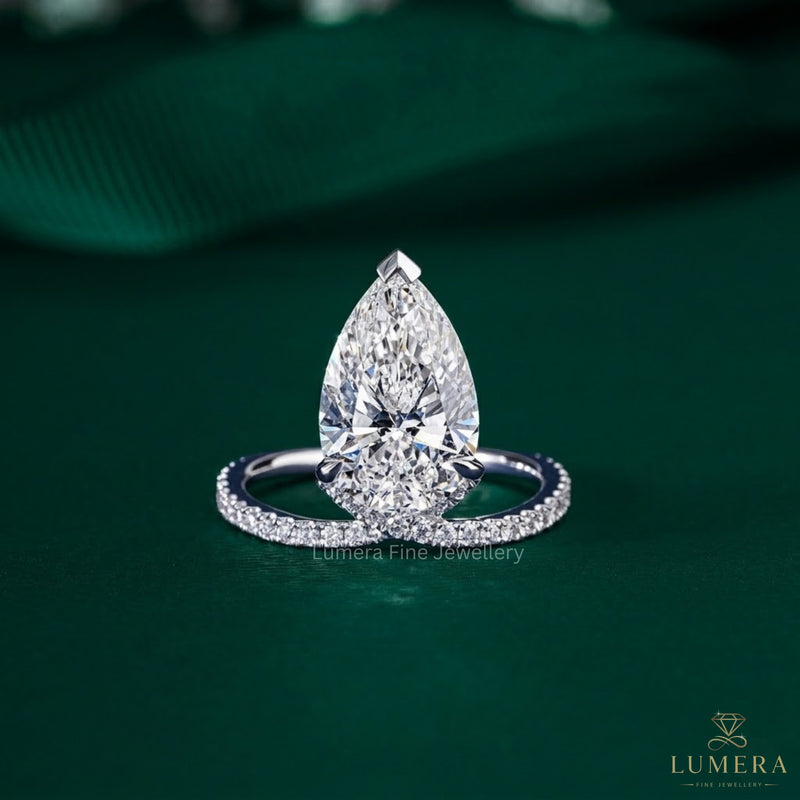 pear diamond engagement ring with split shank pave ring.