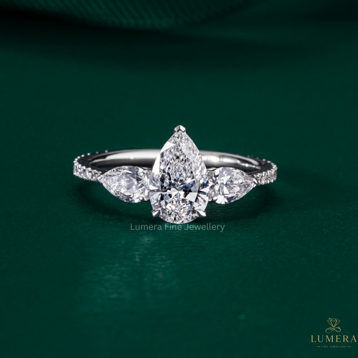Pear diamond three stone ring with Pear side stones.