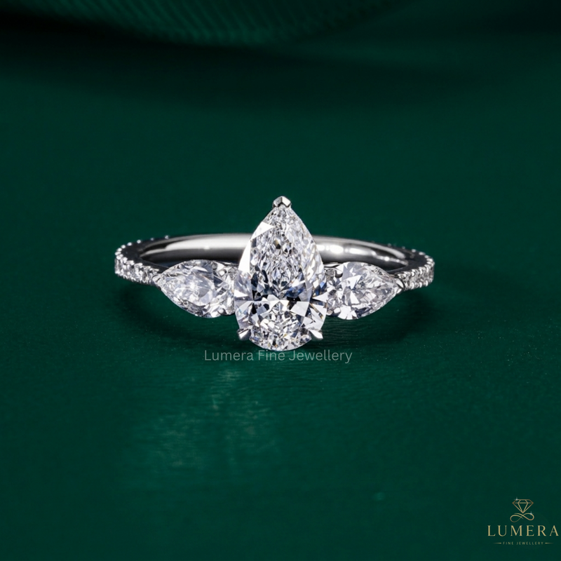 Pear diamond three stone ring with Pear side stones.