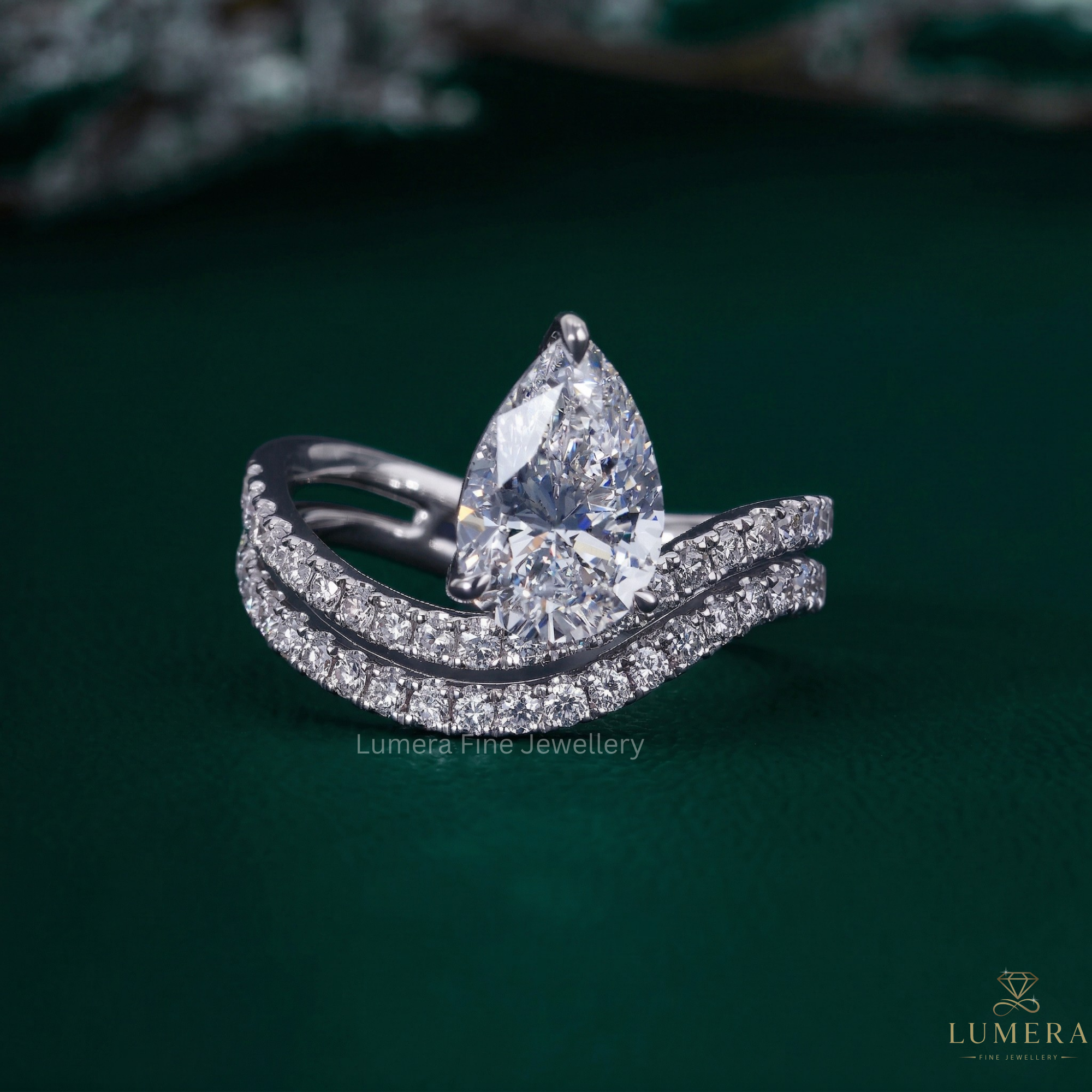 Waves setting engagement ring with Pear wave band.