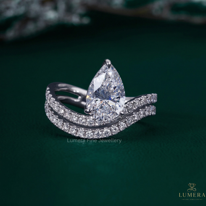 Waves setting engagement ring with Pear wave band.