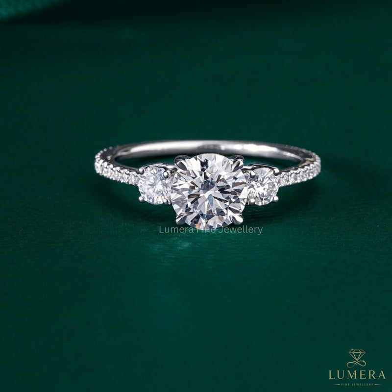 three stone engagement ring with prong setting.