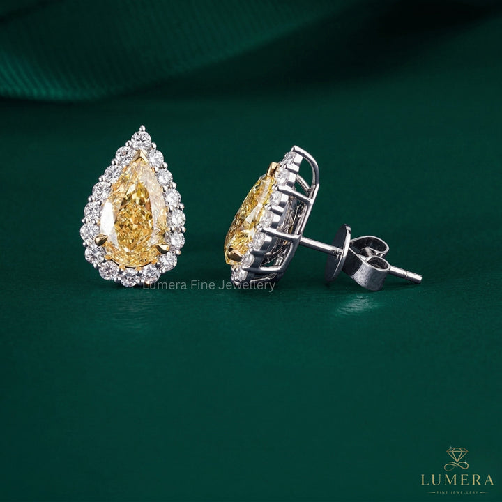 yellow diamond earrings with diamond stud earrings.
