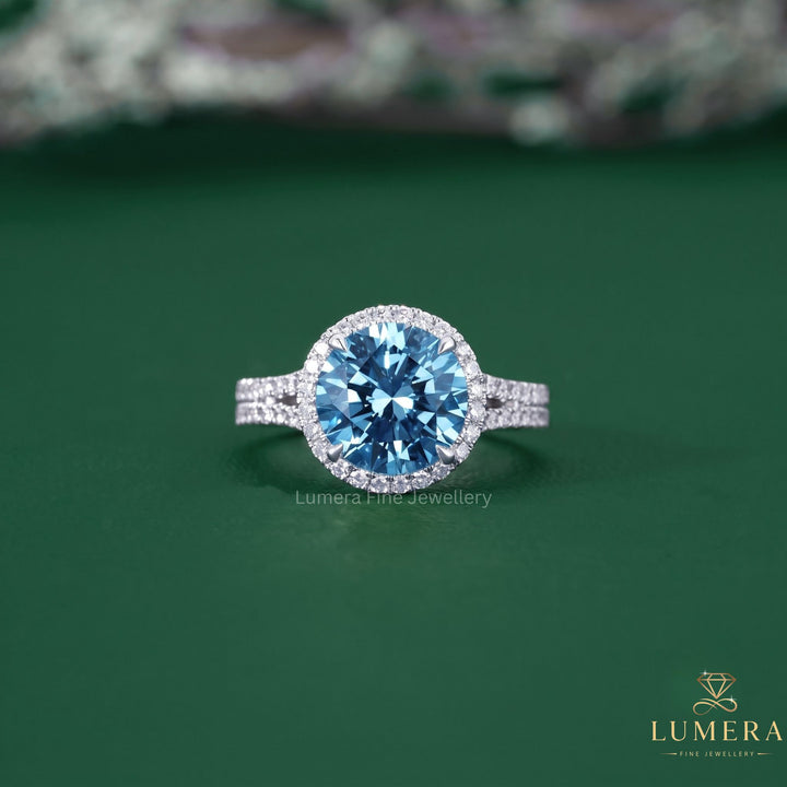 Cathedral engagement ring with blue diamond ring.