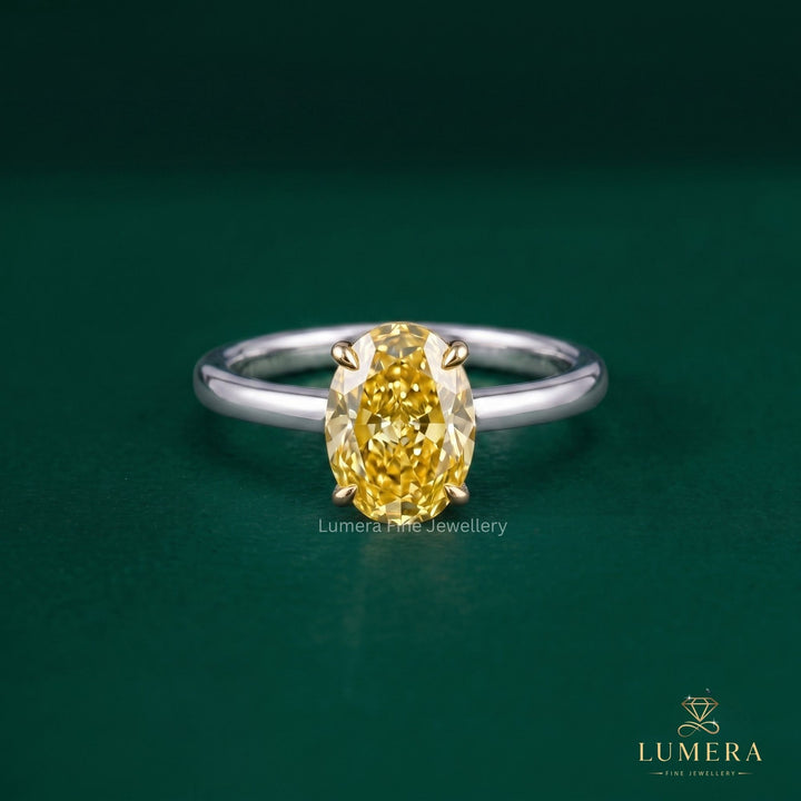 Fancy yellow color ring with yellow oval cut diamond ring.

