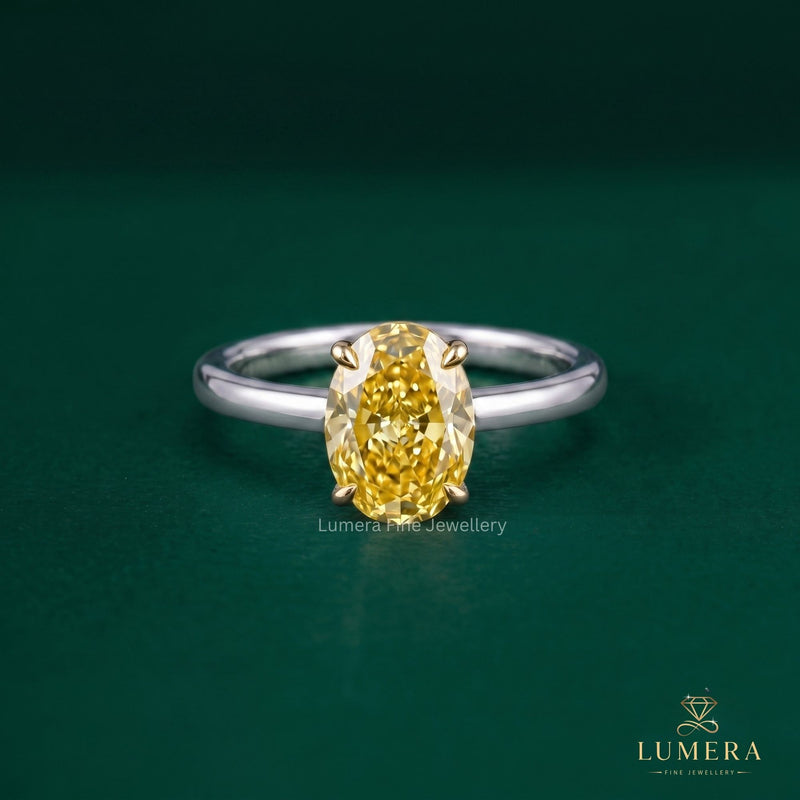 Fancy yellow color ring with yellow oval cut diamond ring.
