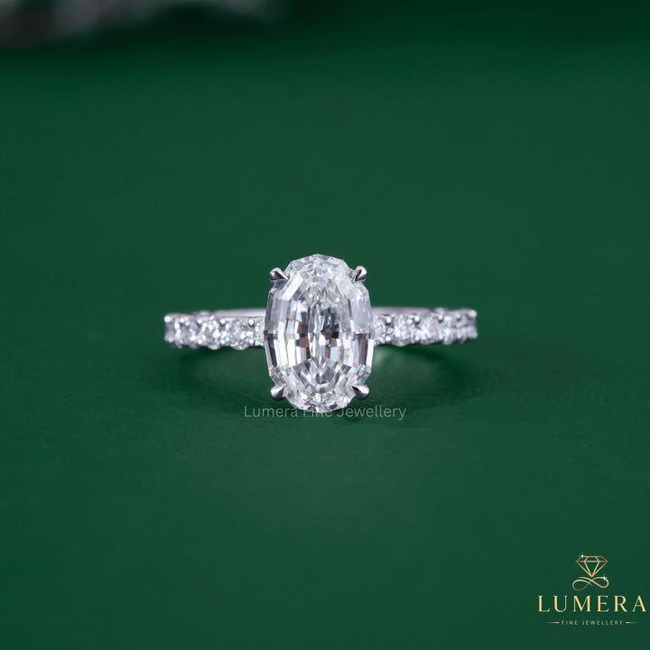 Step cut oval cut engagement ring with antique cut diamond ring.