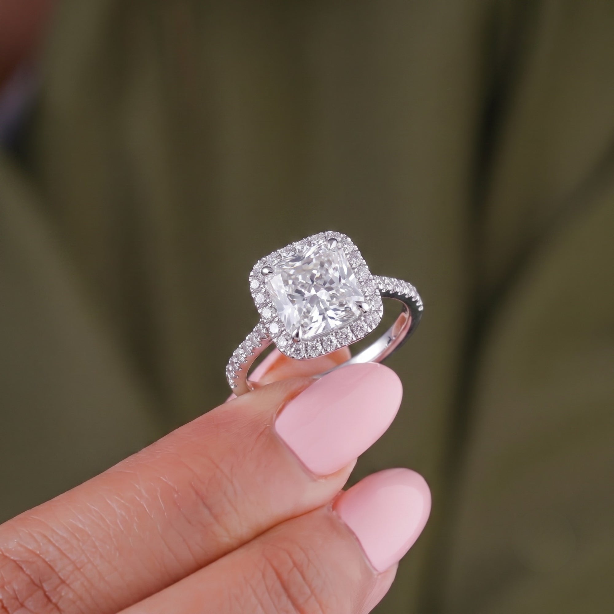 halo diamond engagement ring with cathedral setting ring.
