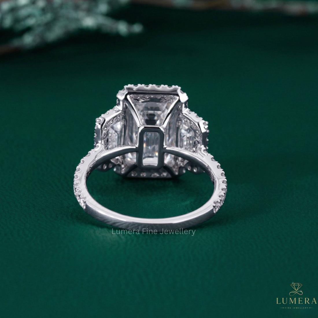 emerald engagement ring with 3 stone engagement ring.