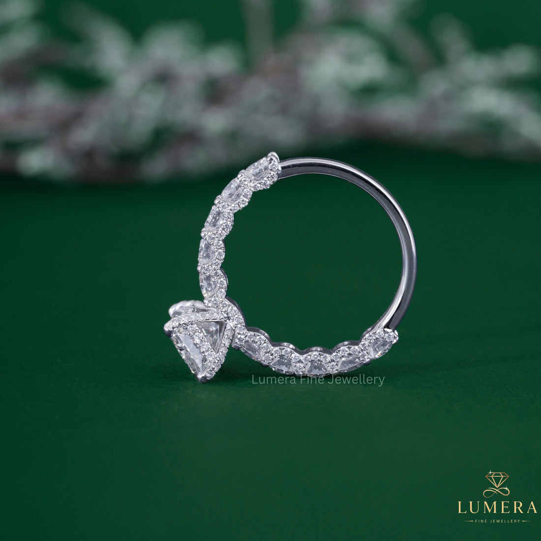 Hidden halo ring with claw prong setting.