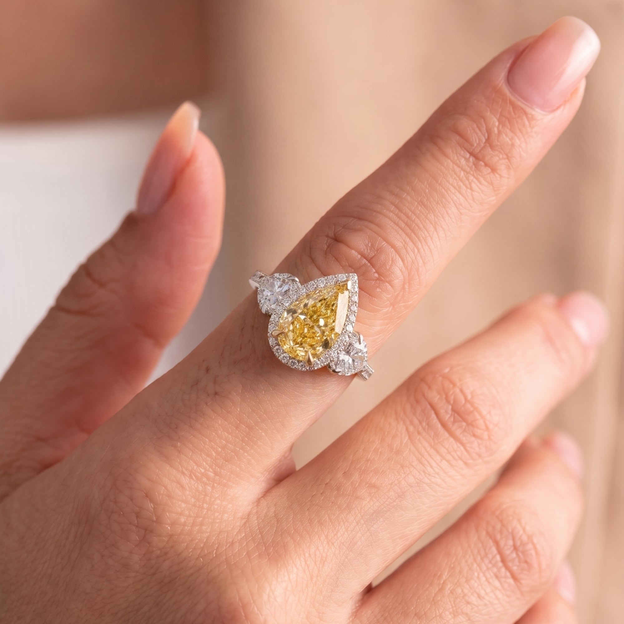 yellow diamond engagement ring with heart side stone.
