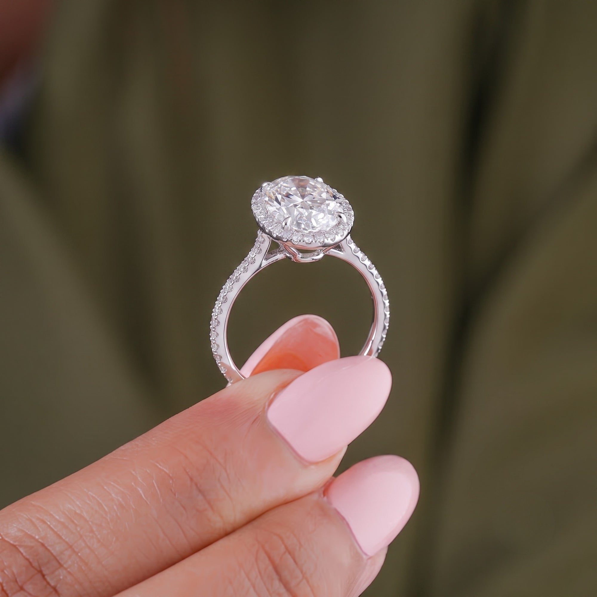 Oval diamond engagement ring with basket setting ring.

