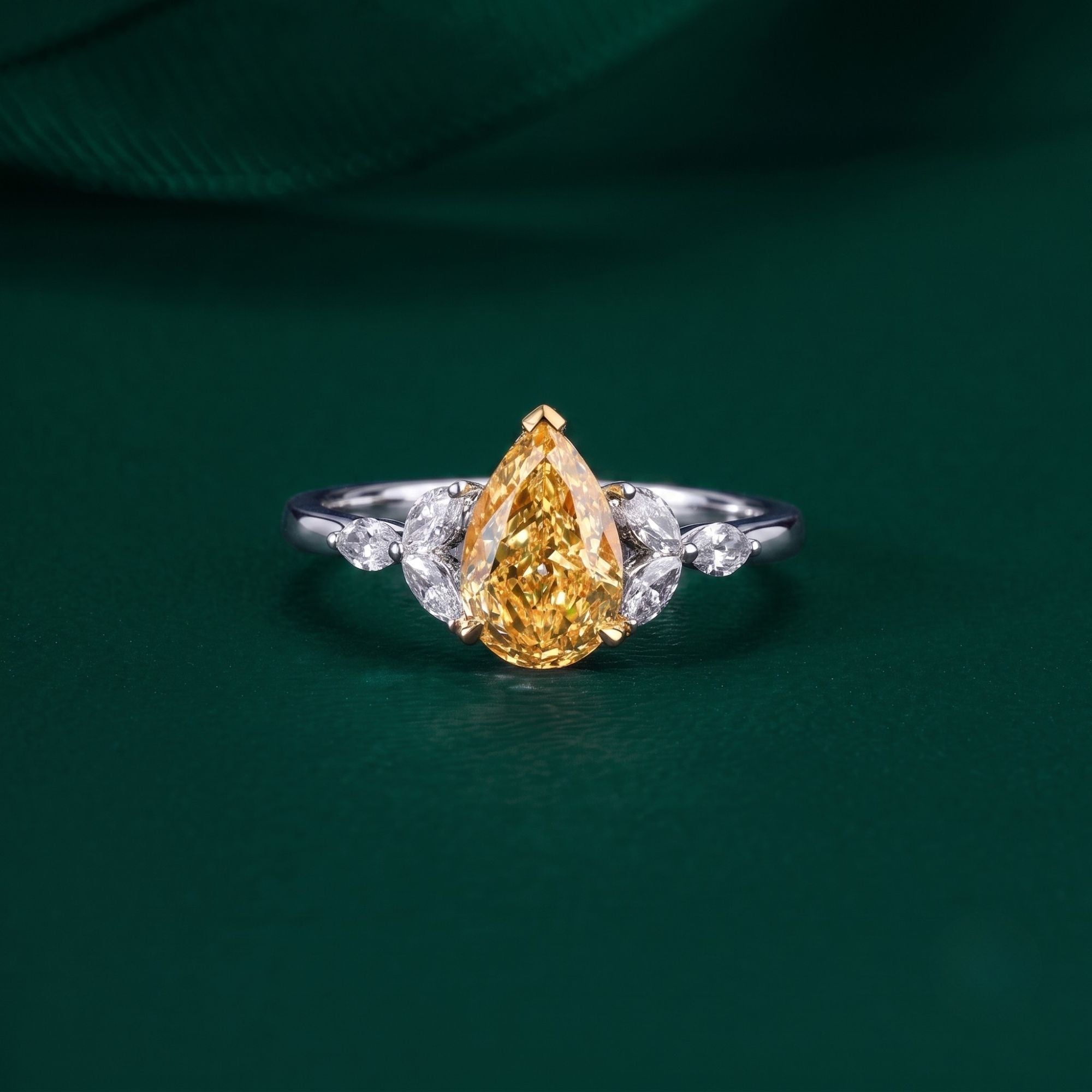 pear shaped engagement ring with muse setting ring.

