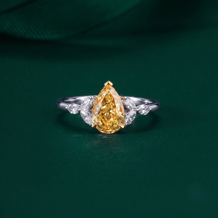 pear shaped engagement ring with muse setting ring.
