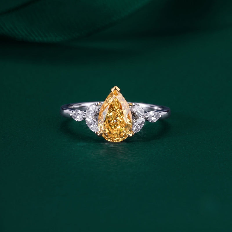 pear shaped engagement ring with muse setting ring.
