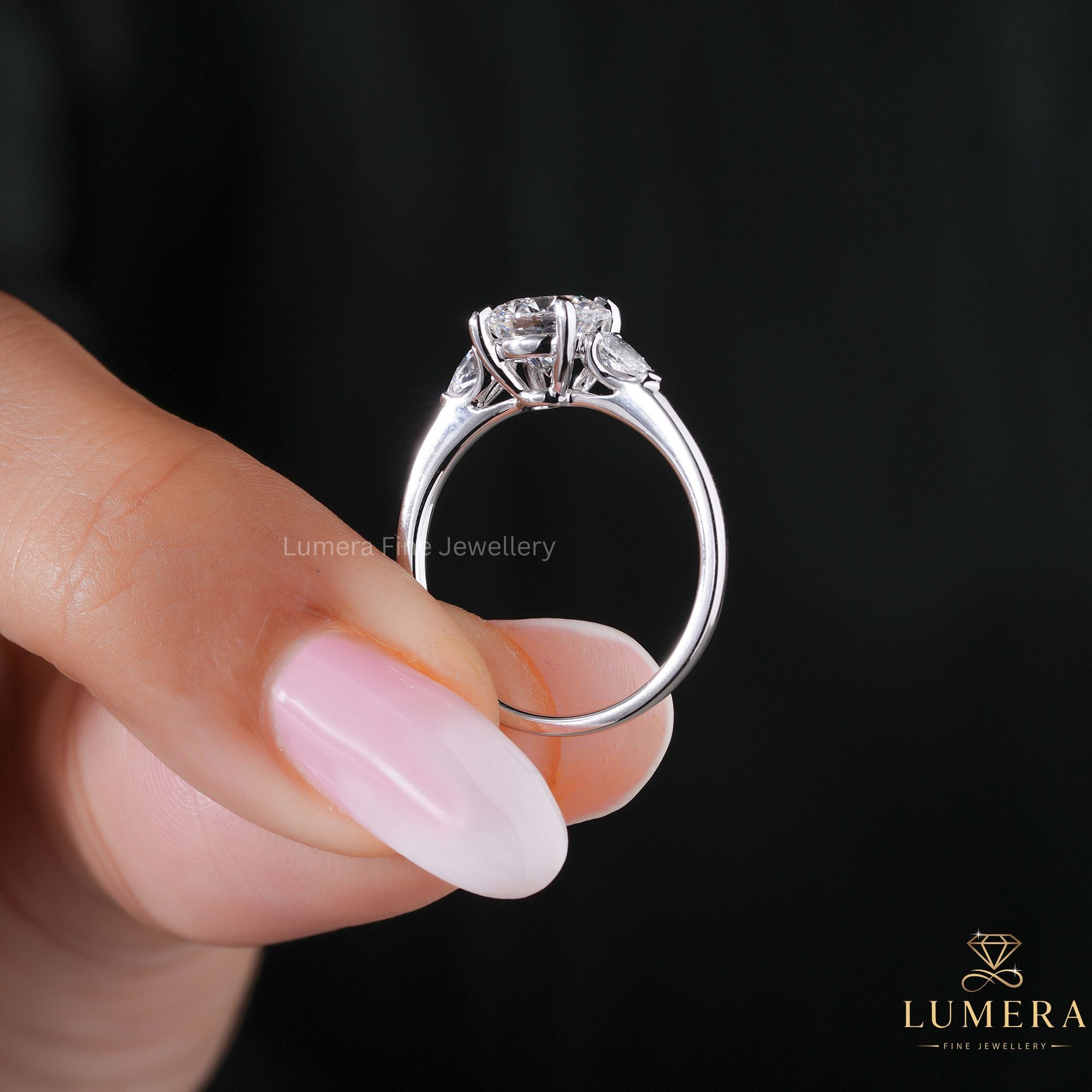 3 stone ring with round pear engagement ring.
