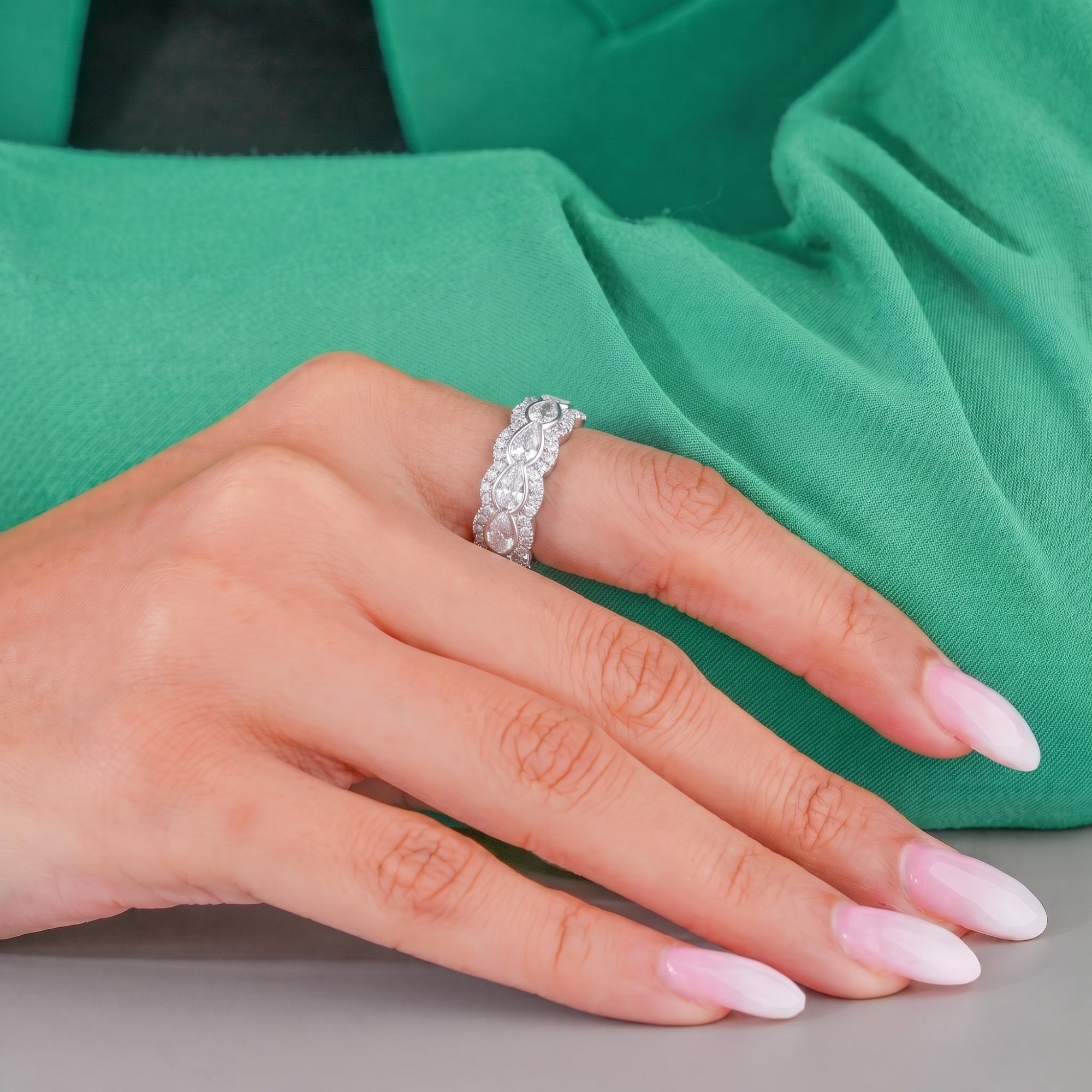 Pear diamond wedding band with halo wedding band.
