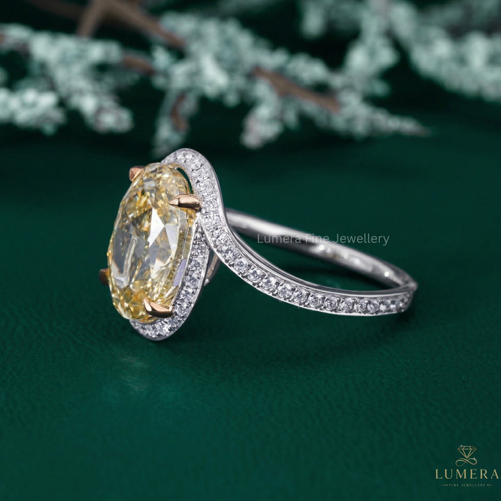 oval cut engagement ring with cathedral setting ring.