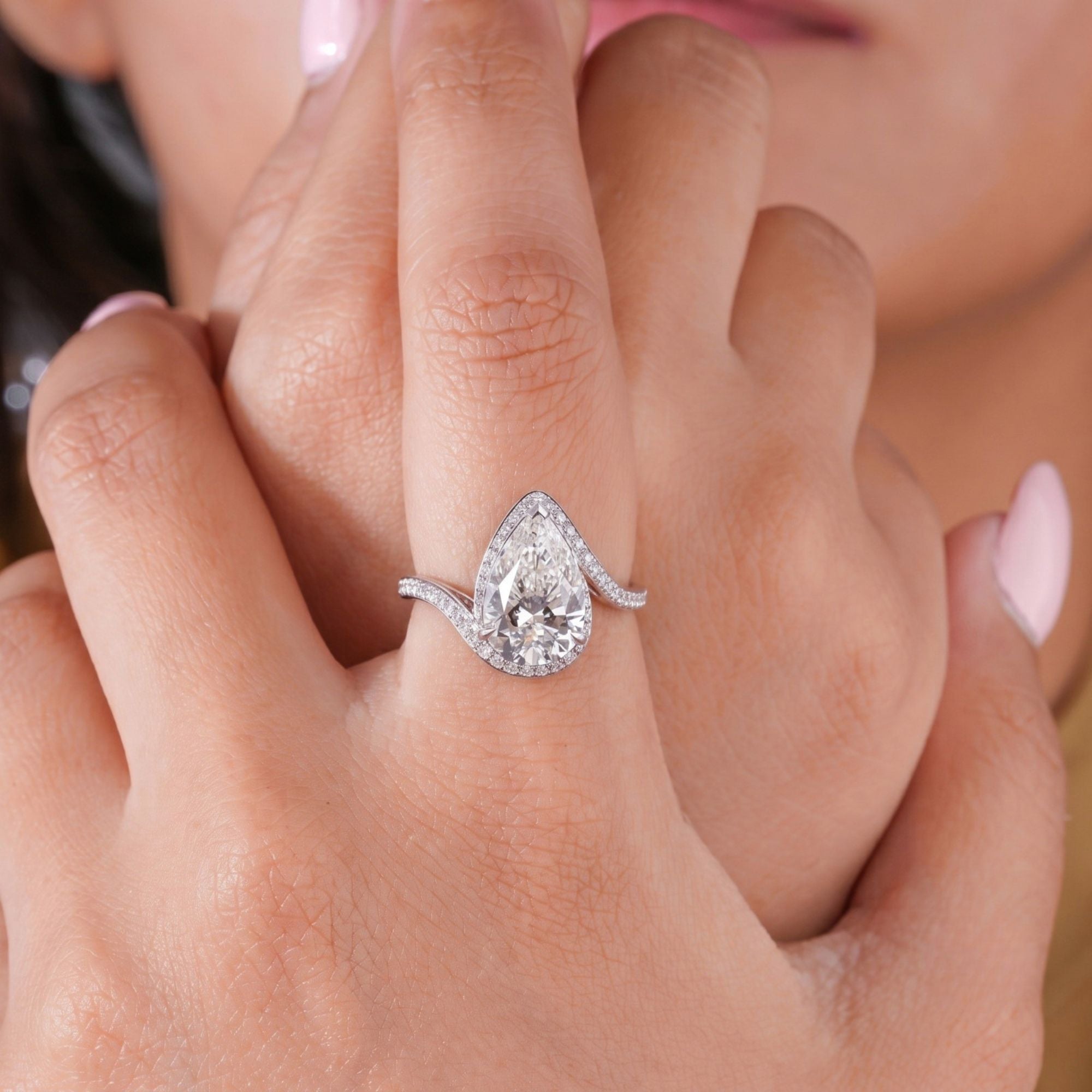 almond engagement ring with tear drop engagement ring.
