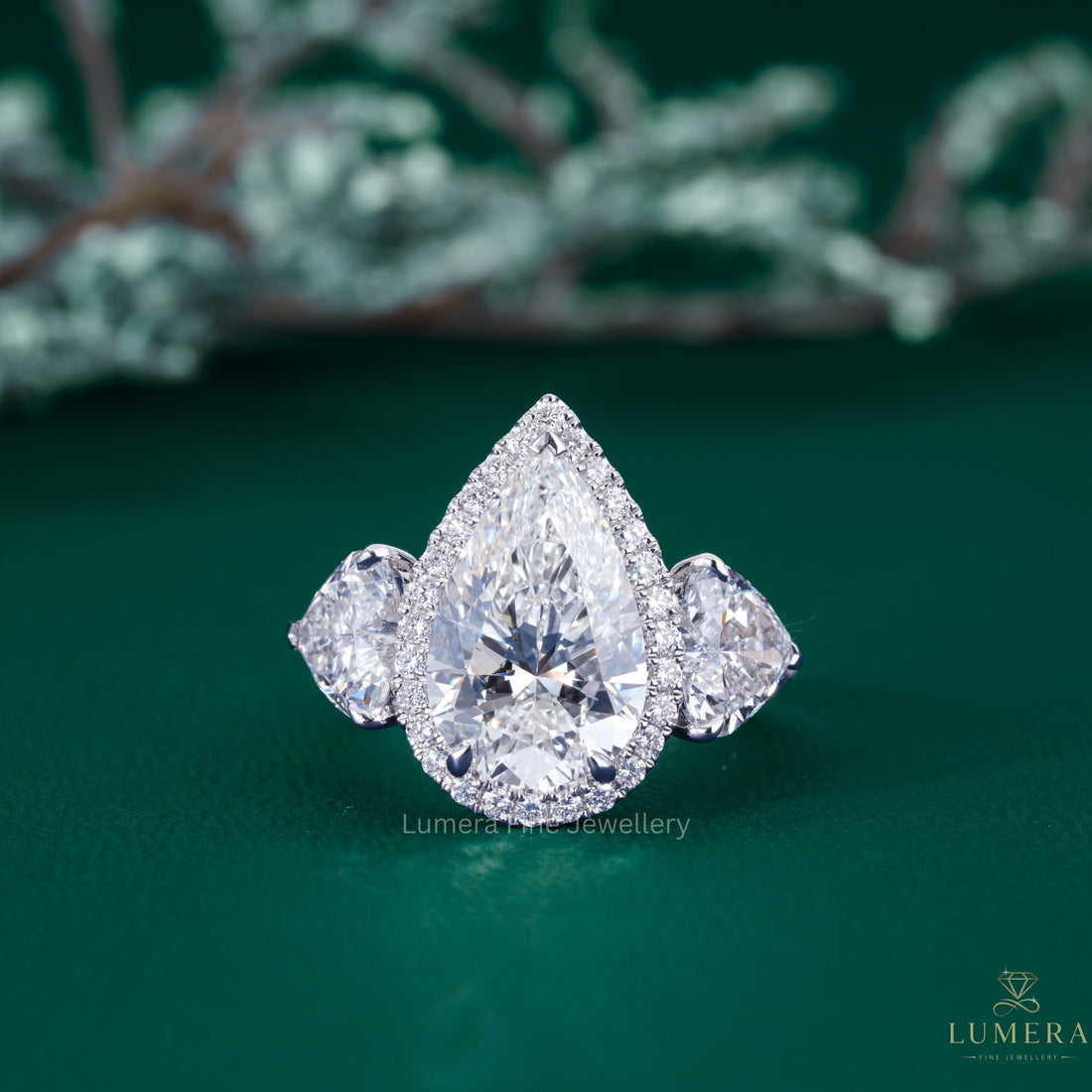 pear engagement ring with pear diamond ring.