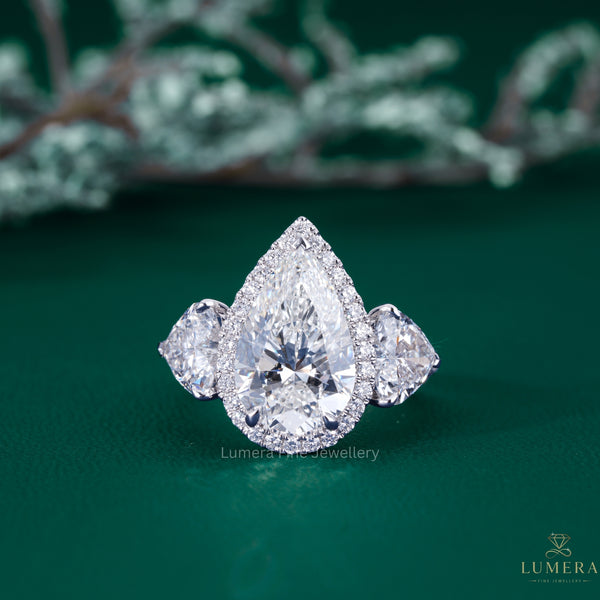 pear engagement ring with pear diamond ring.