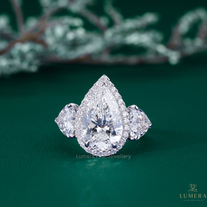 pear engagement ring with pear diamond ring.