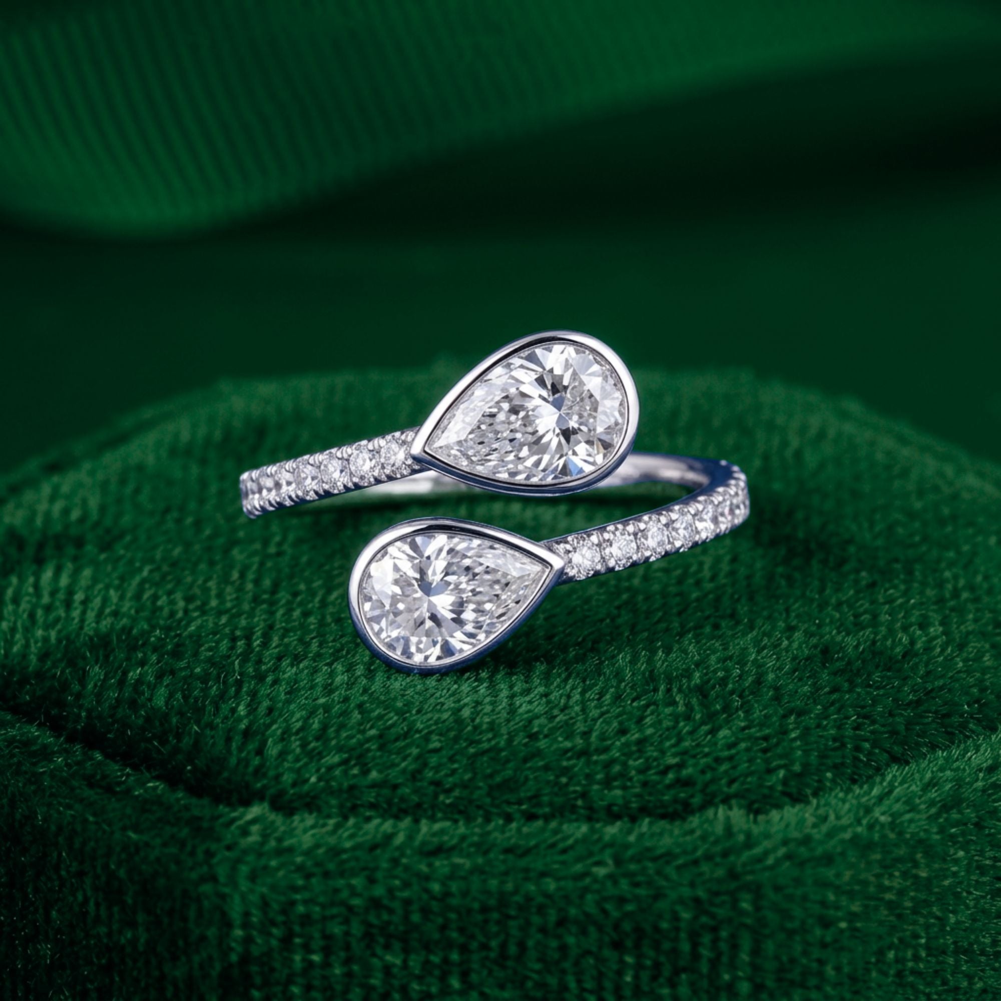 two stone diamond engagement ring with pear shaped ring.
