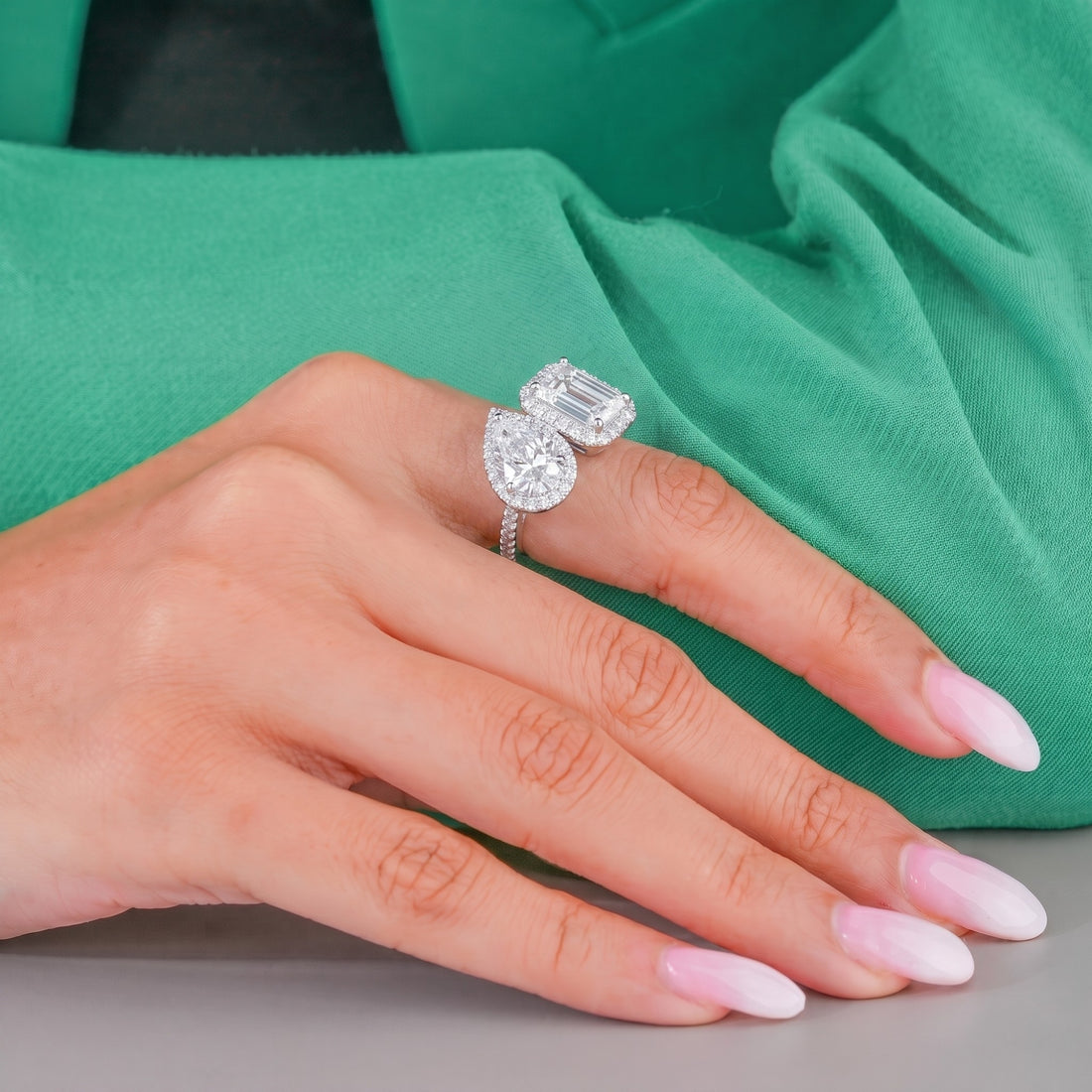Two stone diamond ring with pave ring.
