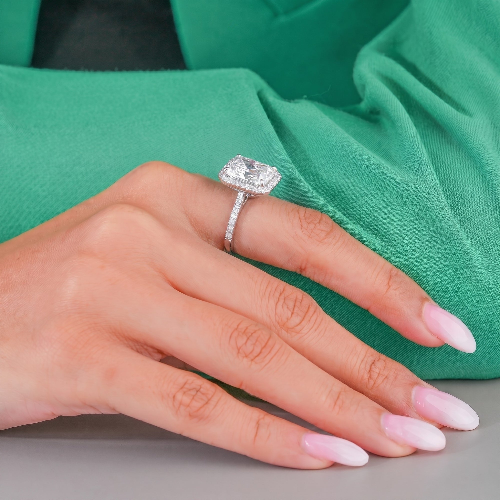 Radiant diamond ring with cathedral setting ring.
