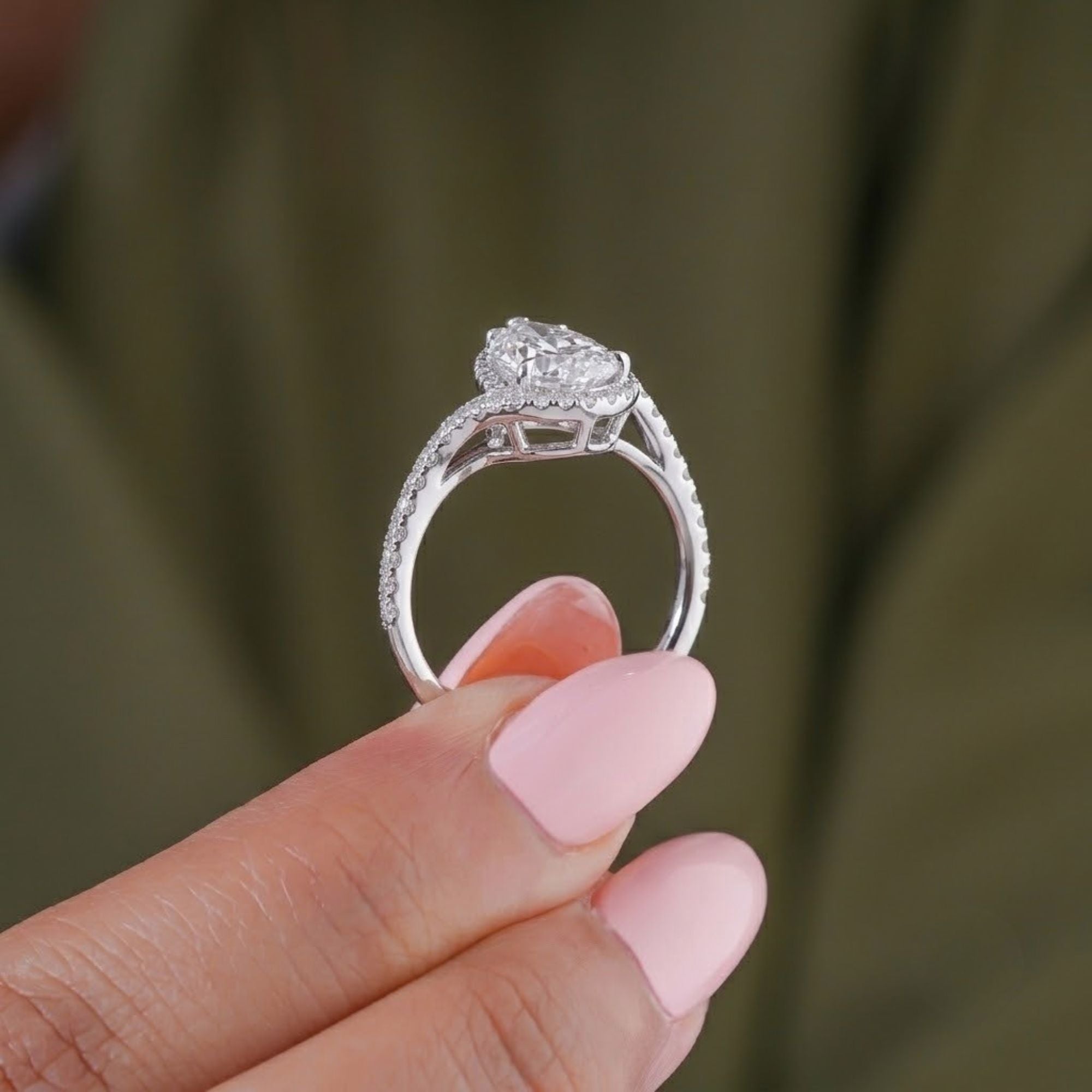 pave setting diamond ring with claw prong setting.
