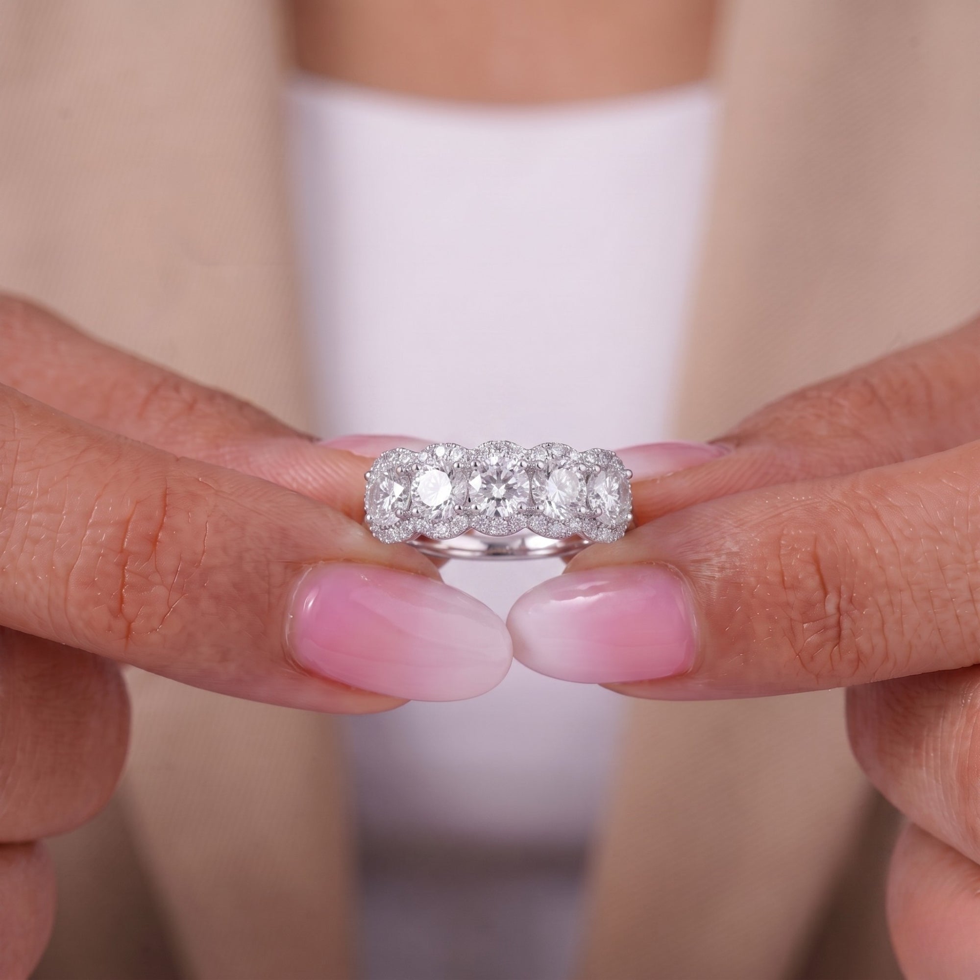 Halo diamond band with 4 prong setting.
