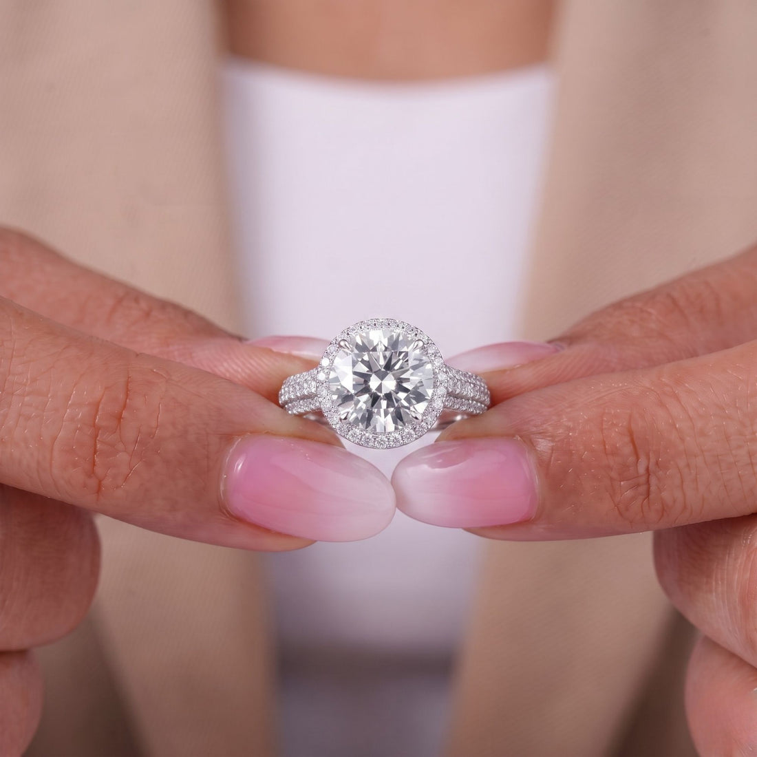 Round diamond engagement ring with hidden side stone ring.
